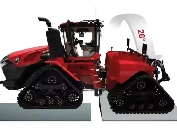 En rød Steiger 785 Quadtrac traktor som viser sin fleksibilitet på ujevnt terreng.