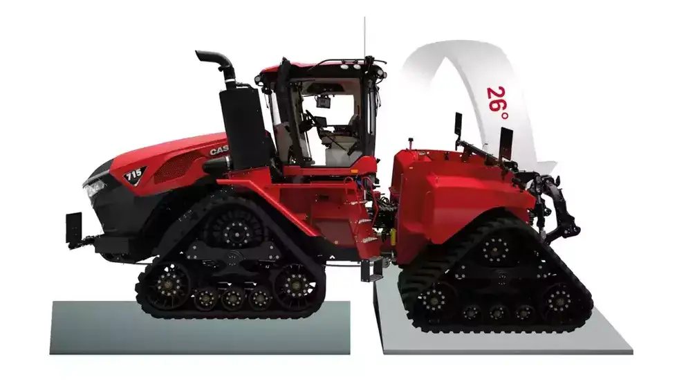 En rød Steiger 785 Quadtrac traktor som viser sin fleksibilitet på ujevnt terreng.